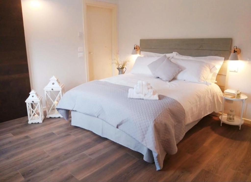 Postel nebo postele na pokoji v ubytování CASA AUTUNNO