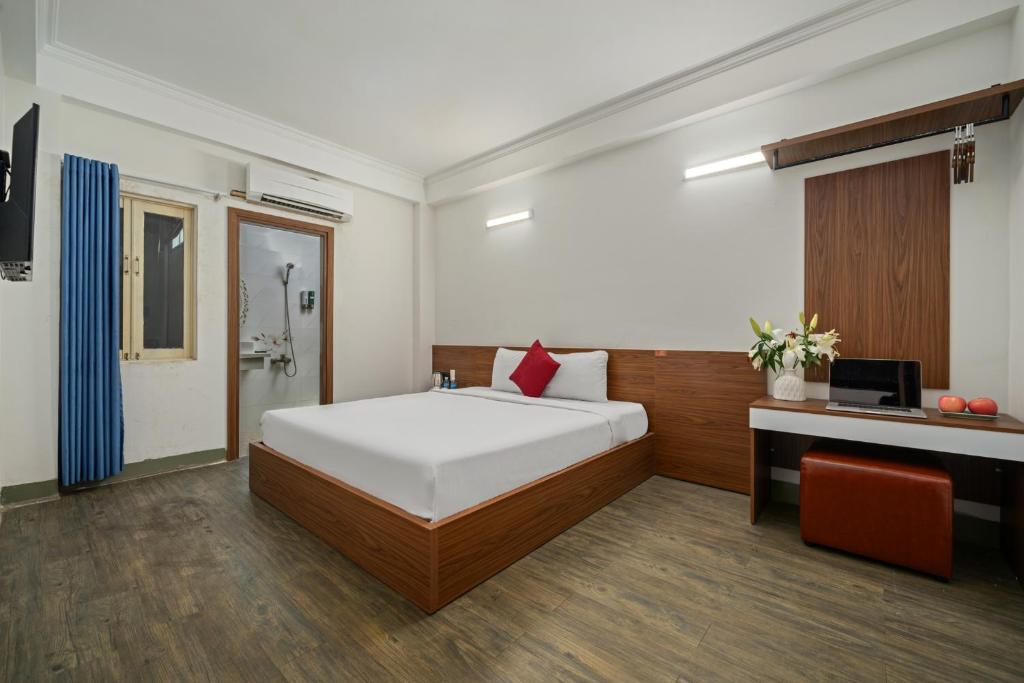 Postel nebo postele na pokoji v ubytování NAMI HOTEL Nha Trang