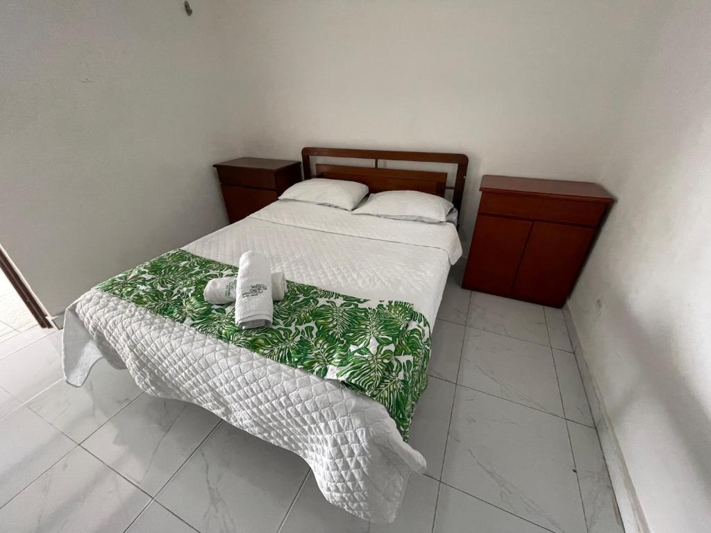 Postel nebo postele na pokoji v ubytování Hotel Maratea Melgar