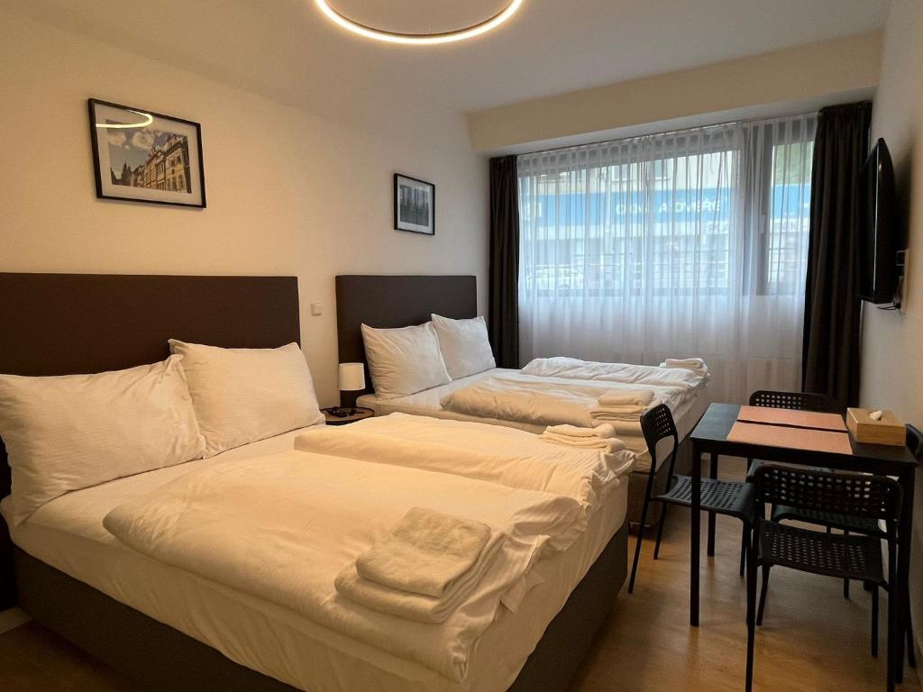 Postel nebo postele na pokoji v ubytování Post 120 Suites