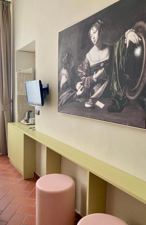 Telewizja i/lub zestaw kina domowego w obiekcie Hotel Caravaggio