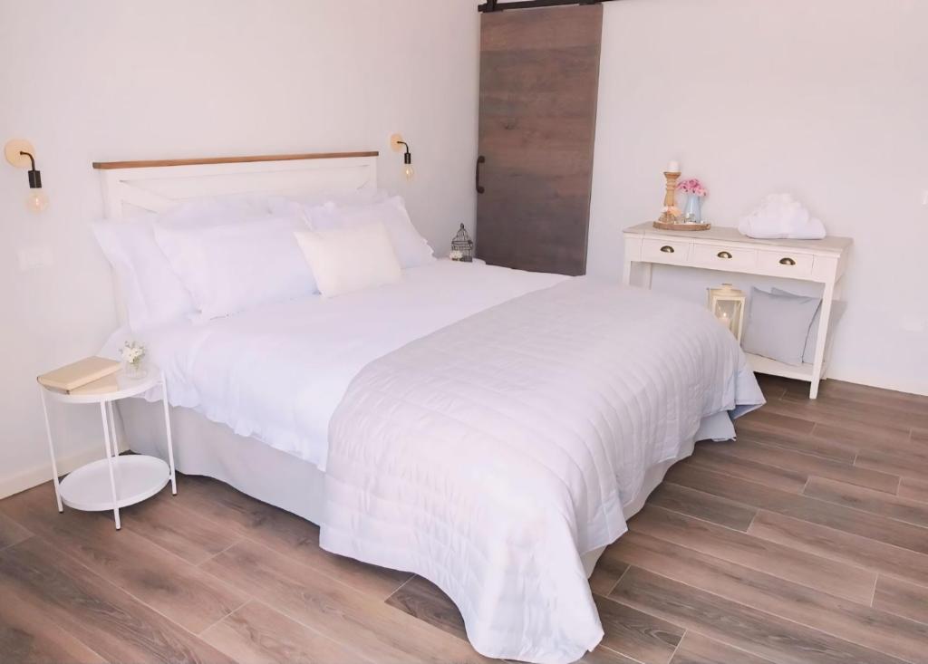 Postel nebo postele na pokoji v ubytování CASA AUTUNNO