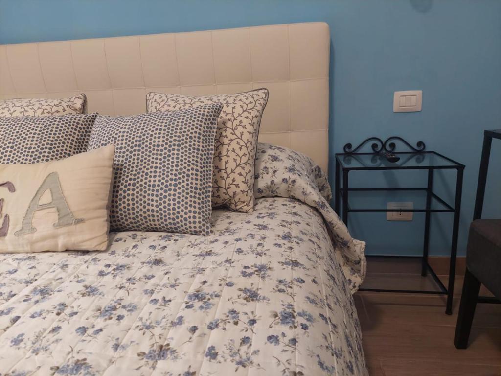 a bedroom with a bed with blue walls at Albamare in Monterosso al Mare
