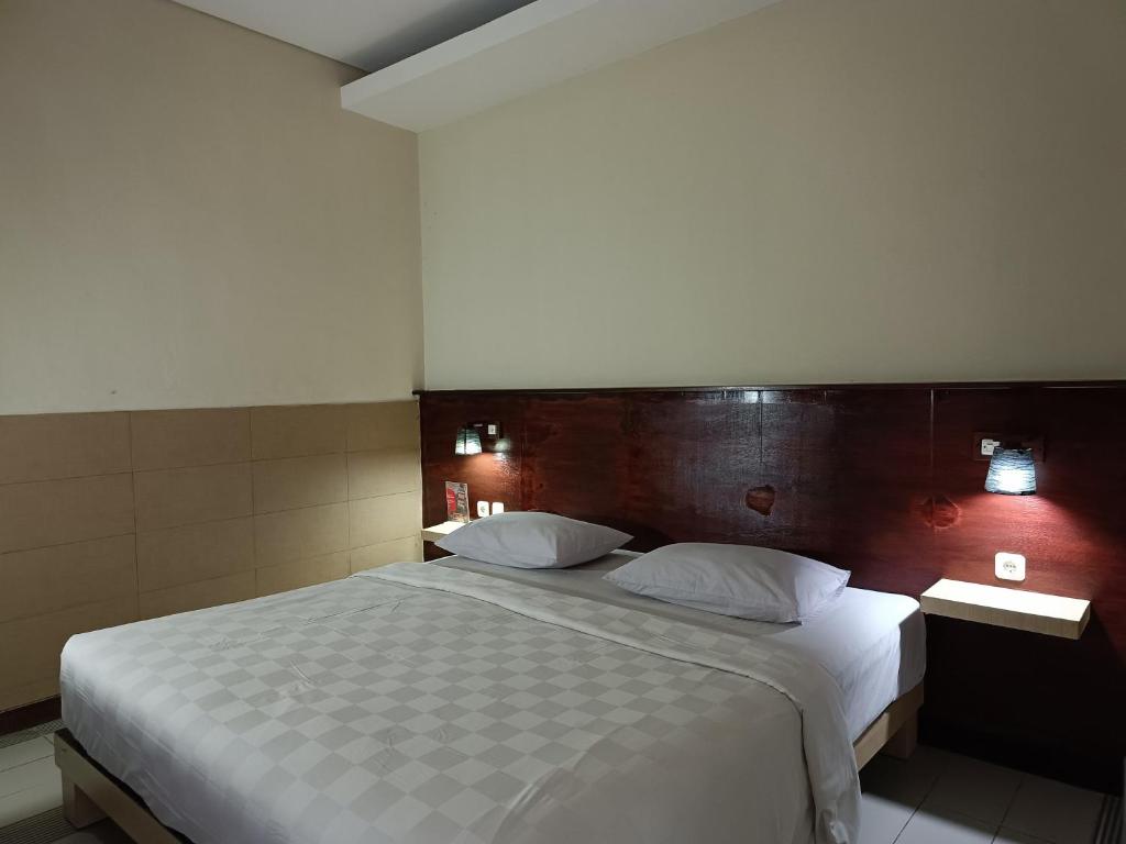 Postel nebo postele na pokoji v ubytování Keola Hotel Legian