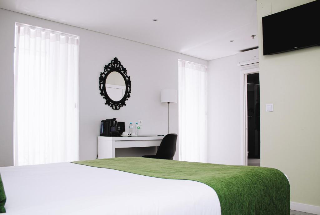 Кровать или кровати в номере Rio Art Hotel