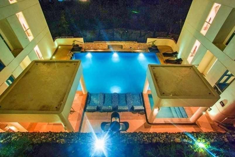 an overhead view of a swimming pool in a house at Cozy studio unit in Boracay Newcoast in Boracay