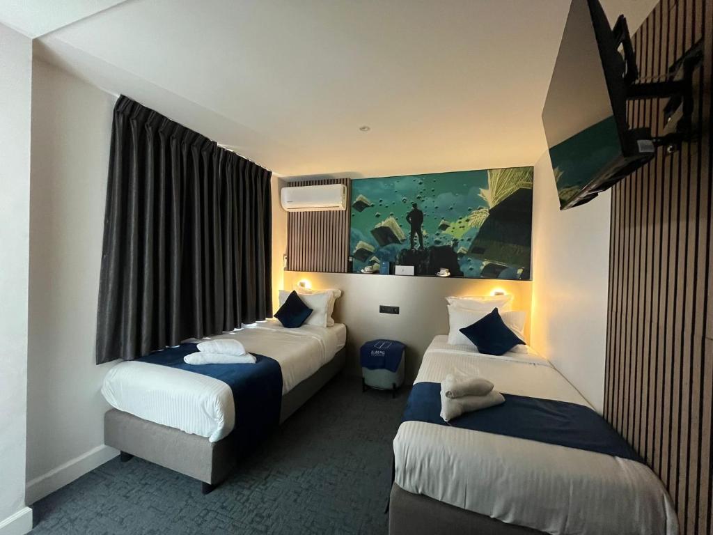 Rúm í herbergi á Elberg Hotel & Apartments