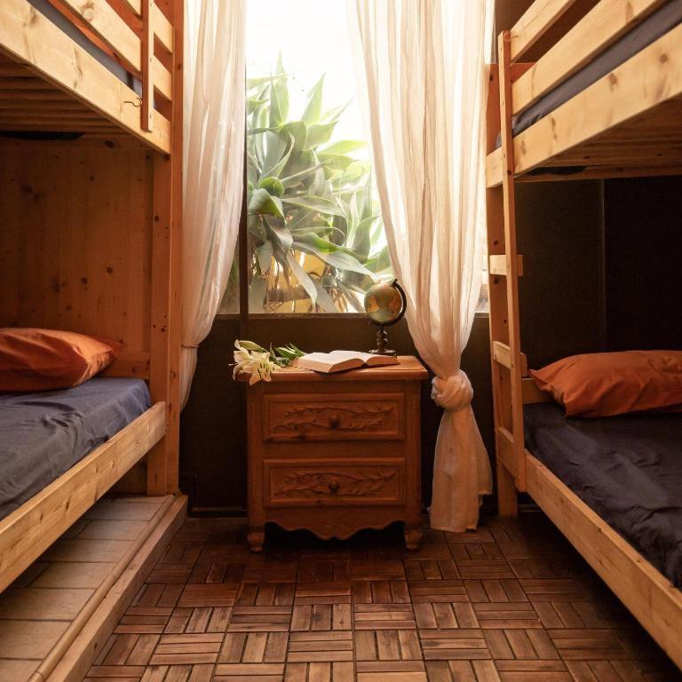 Postel nebo postele na pokoji v ubytování Los Amigos Nest Hostel