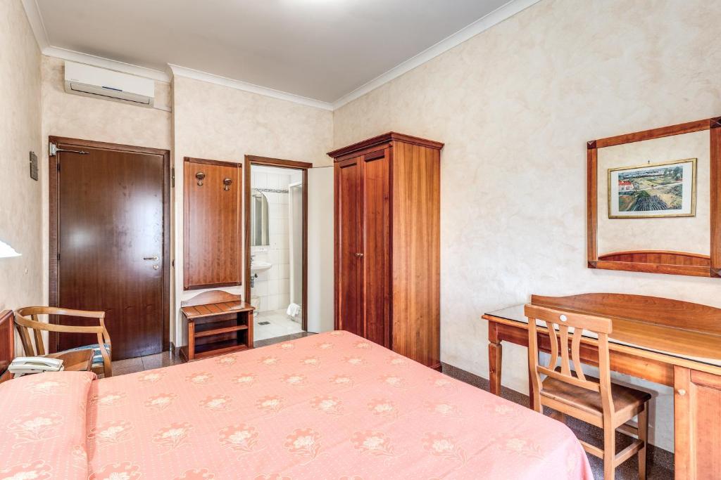 Postel nebo postele na pokoji v ubytování Hotel Milo