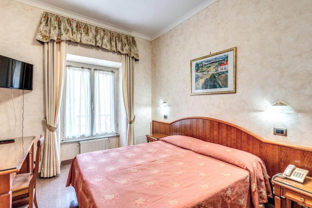 Postel nebo postele na pokoji v ubytování Hotel Milo
