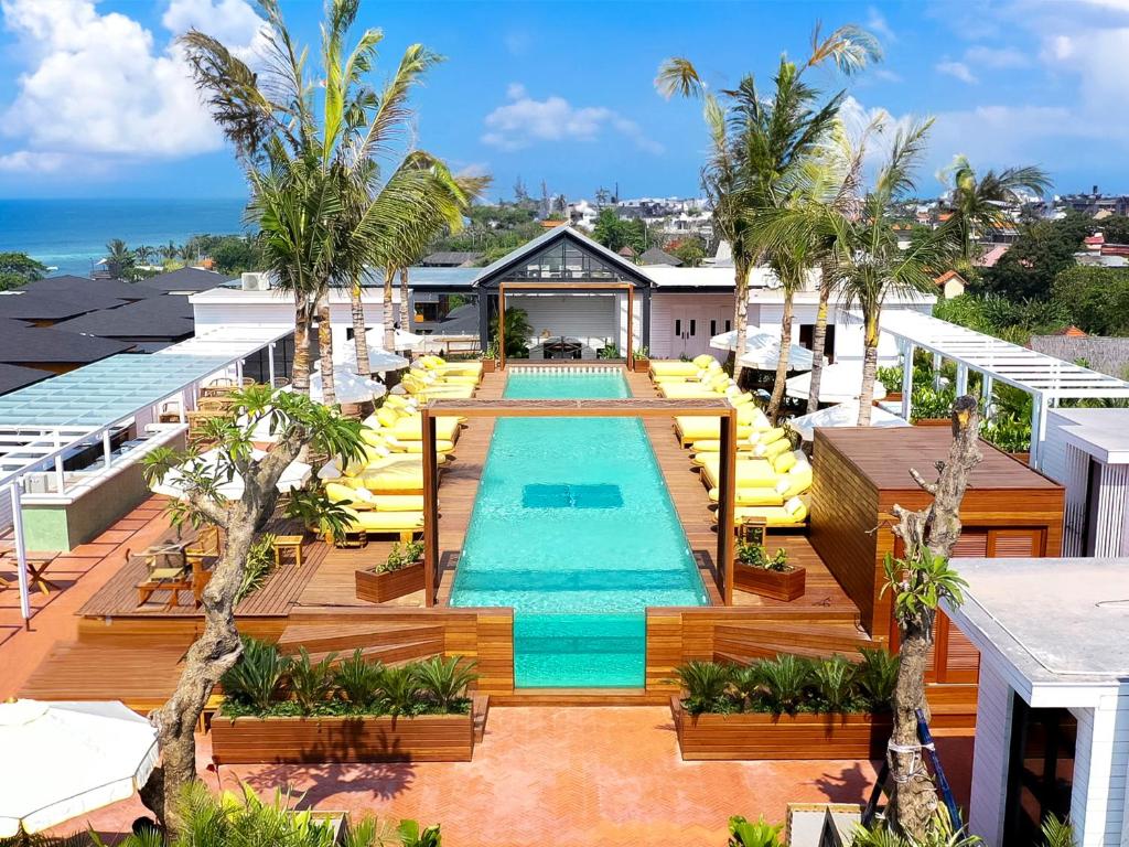 an overhead view of a pool at a resort at Secana Beachtown in Canggu