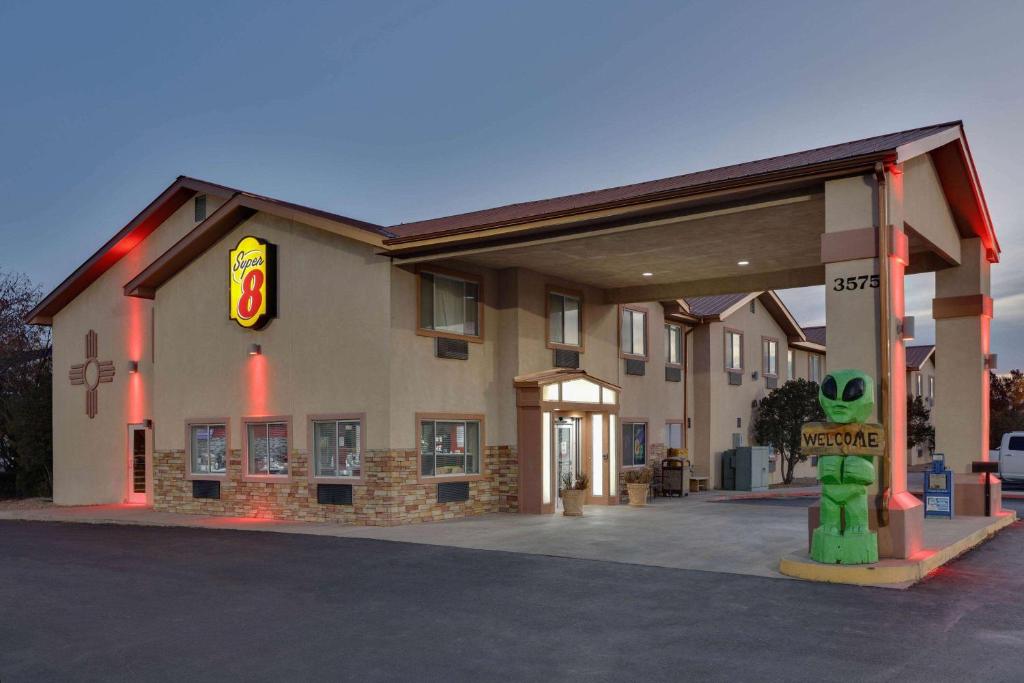 a mcdonalds building with a sign in front of it at Super 8 by Wyndham Roswell in Roswell