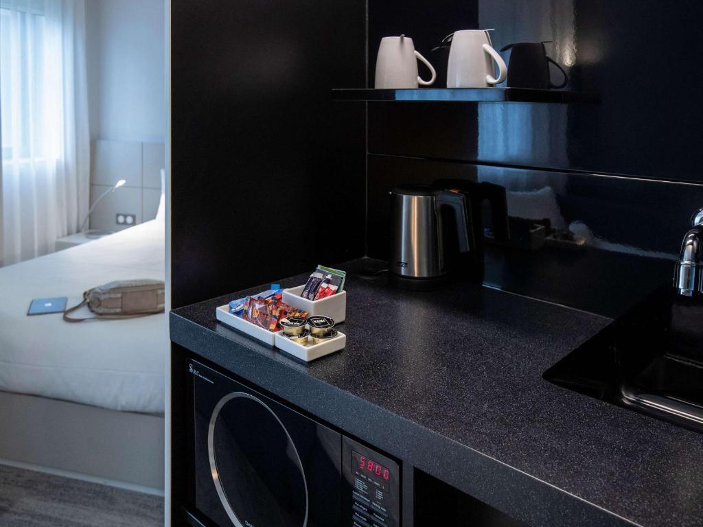 Kuchyň nebo kuchyňský kout v ubytování Novotel Suites Luxembourg
