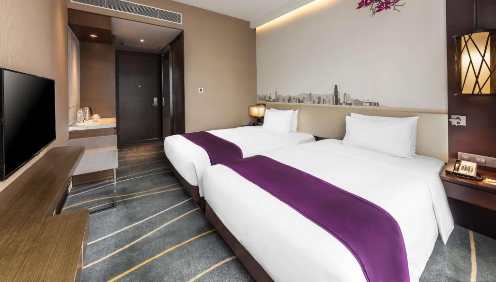 Letto o letti in una camera di Hilton Garden Inn Hong Kong Mongkok