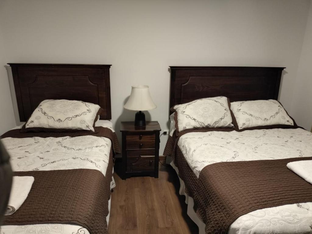 Postel nebo postele na pokoji v ubytování HOTEL QUINTA ESTACIÓN