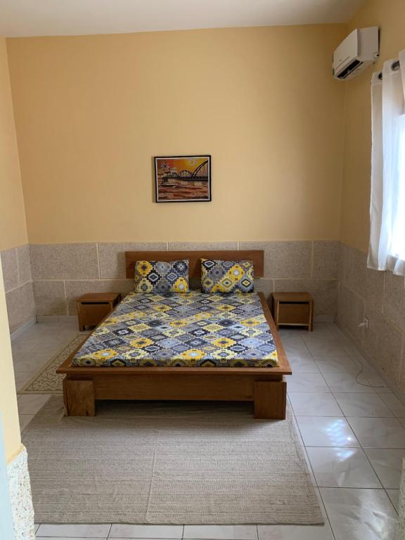 A bed or beds in a room at Thiossane