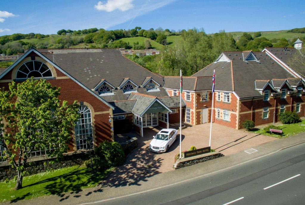 una vista aérea de una casa con un coche aparcado delante en Heritage Park Pontypridd, Trademark Collection by Wyndham en Pontypridd