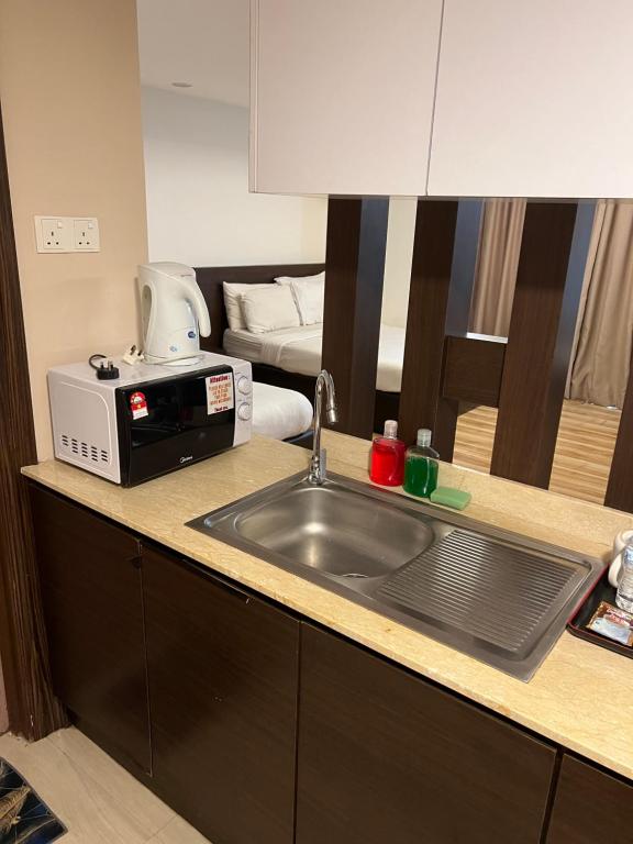 Kuchyň nebo kuchyňský kout v ubytování Studio Exclusive (Kota Bharu City Point)