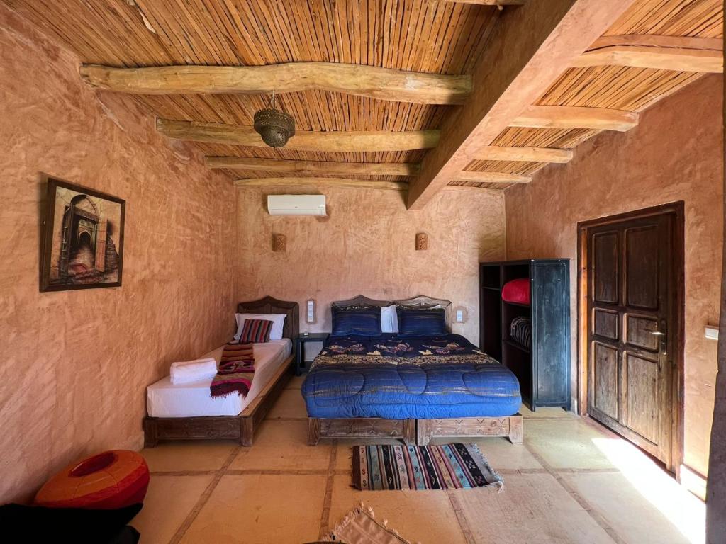 Een bed of bedden in een kamer bij Palais D'Ouzoud