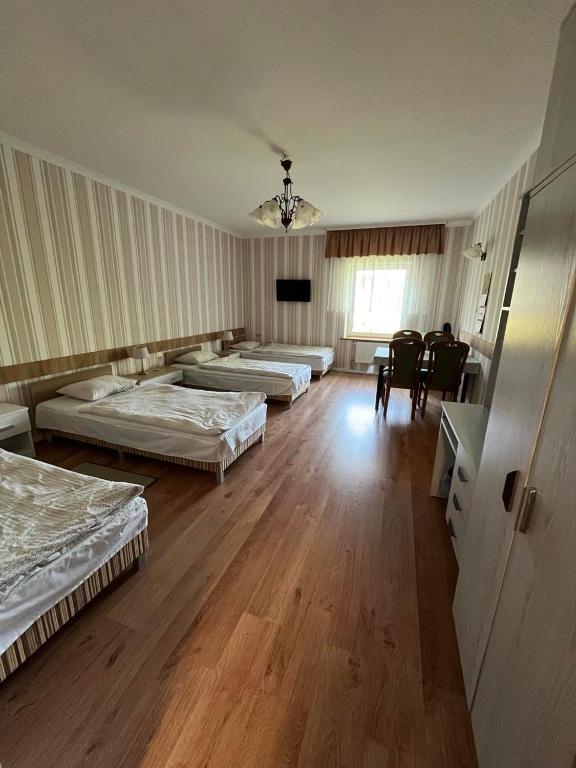Postel nebo postele na pokoji v ubytování Dom Gościnny BIEGUN