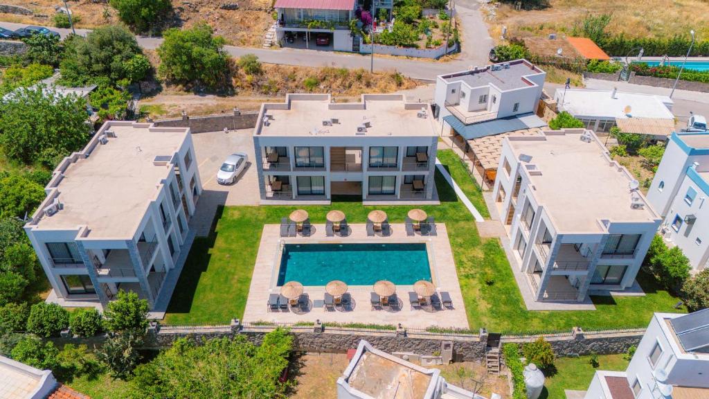 an aerial view of a house with a swimming pool at Ben Houses Family in Bodrum City