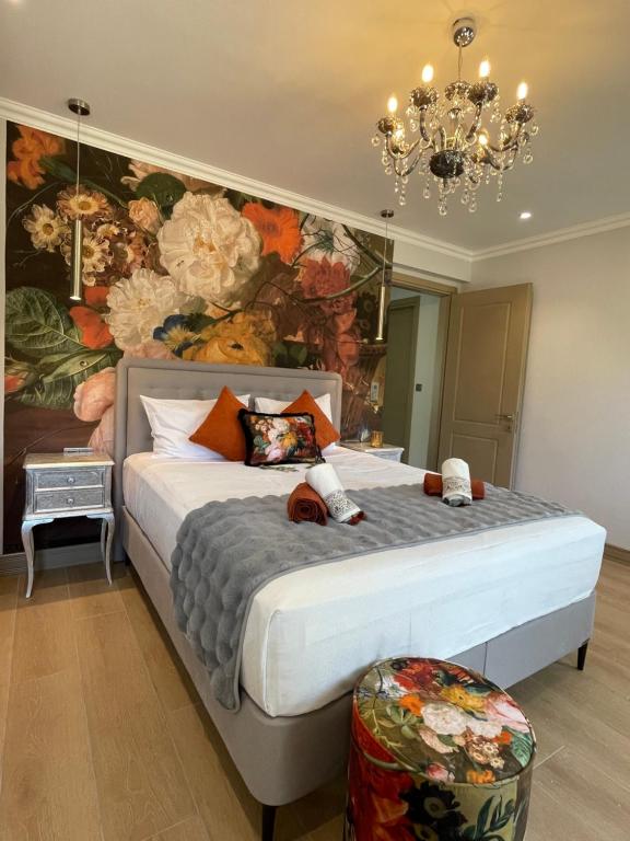 a bedroom with a large bed with a flower mural at Casa Teresi Thassos in Prinos