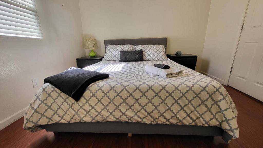 a bedroom with a bed with two towels on it at Unit 1 - Modern Roosevelt Row Condo 2BR 1BA Downtown Stay in Phoenix