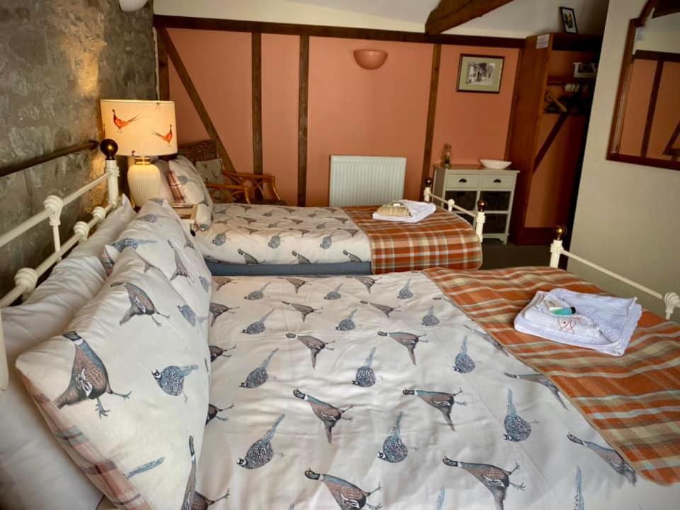 Posteľ alebo postele v izbe v ubytovaní The George and Dragon Inn
