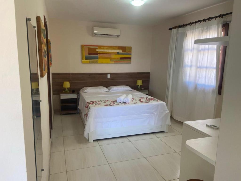 Postel nebo postele na pokoji v ubytování Hotel Pousada Salvador Paradise