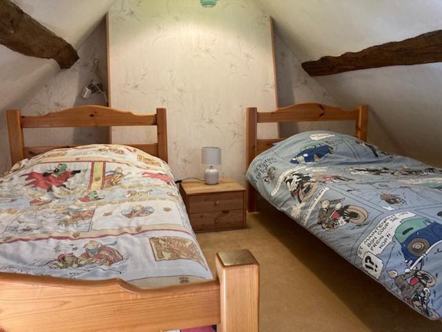 Uma cama ou camas num quarto em Le Bois Hamon