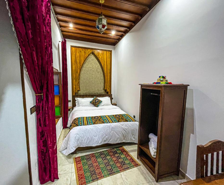 Postel nebo postele na pokoji v ubytování Riad el wazzania