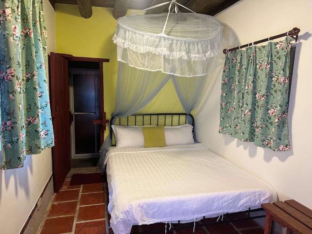 Postel nebo postele na pokoji v ubytování XQ B&B