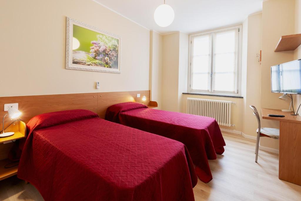 Postel nebo postele na pokoji v ubytování Residenza CONCORDIA