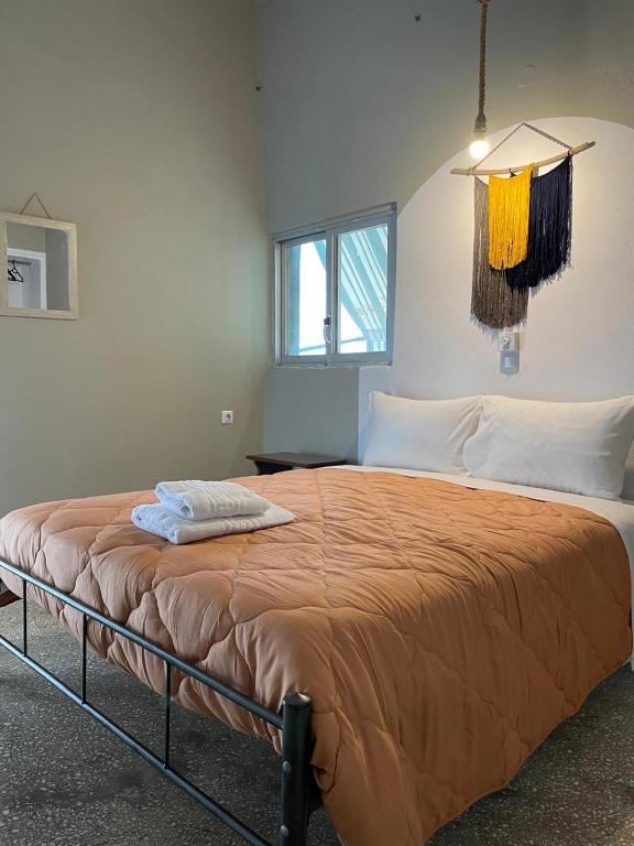 a bedroom with a large bed in a room at Village Holidays - Chelonaria in Chrani