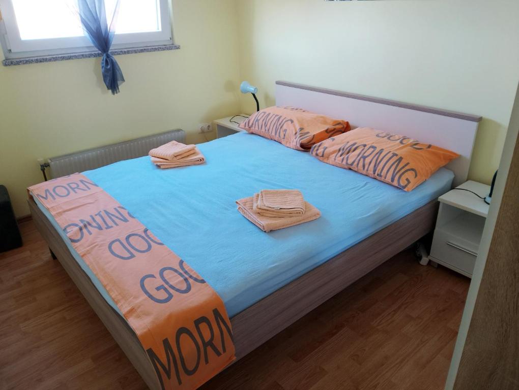 a bedroom with a bed with two pillows on it at Rise and shine! in Pula