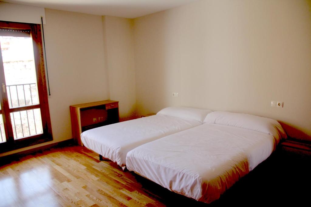 Posteľ alebo postele v izbe v ubytovaní Hostal Rural 18 de Abril
