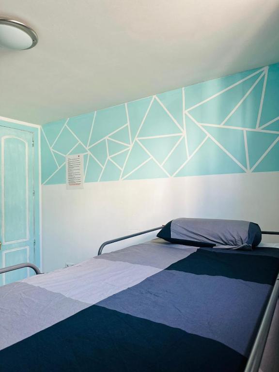 Postel nebo postele na pokoji v ubytování La Fresa Hostel