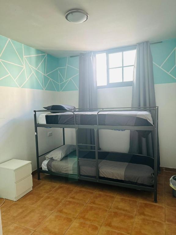 Postel nebo postele na pokoji v ubytování La Fresa Hostel