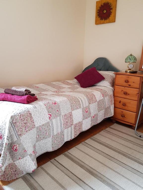 Postel nebo postele na pokoji v ubytování Bernie's Place - Homestay