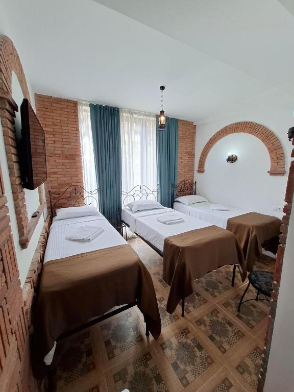 Postel nebo postele na pokoji v ubytování Janashia Boutique Hotels