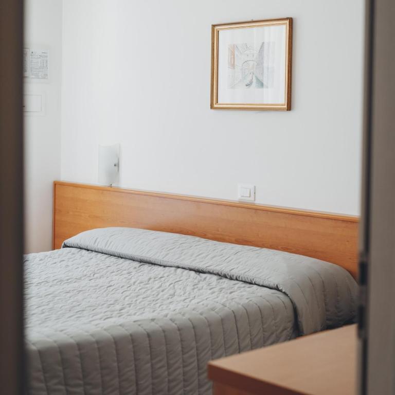 Postel nebo postele na pokoji v ubytování Hotel Jesulum