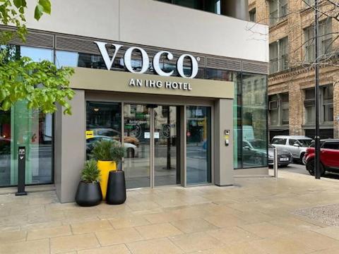 a vogoco store on the side of a building at voco Manchester - City Centre, an IHG Hotel in Manchester