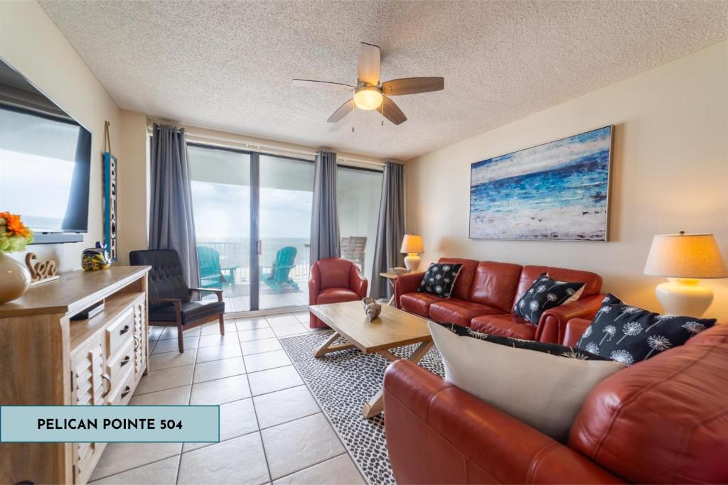 a living room with a couch and a table at Pelican Pointe 504 in Orange Beach