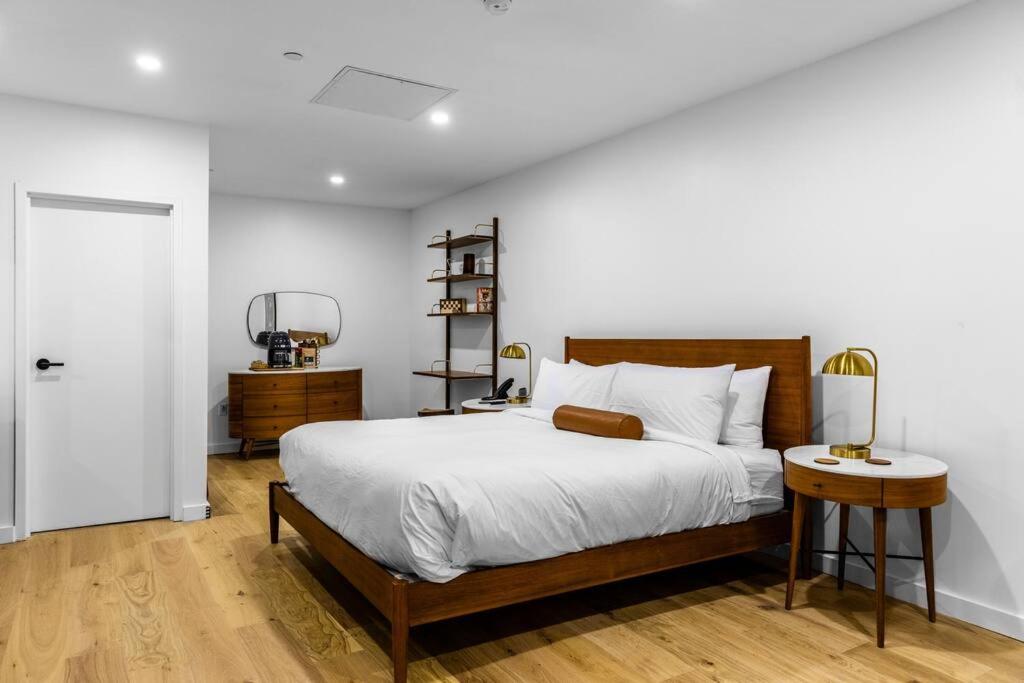 a bedroom with a large bed and a table at King Bed, Historic Hotel, Bangor, Room # 101 in Bangor