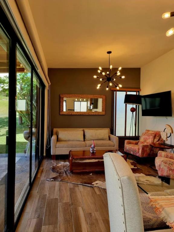 a living room with a couch and a table at Ideal home for your next get away in San Miguel de Allende
