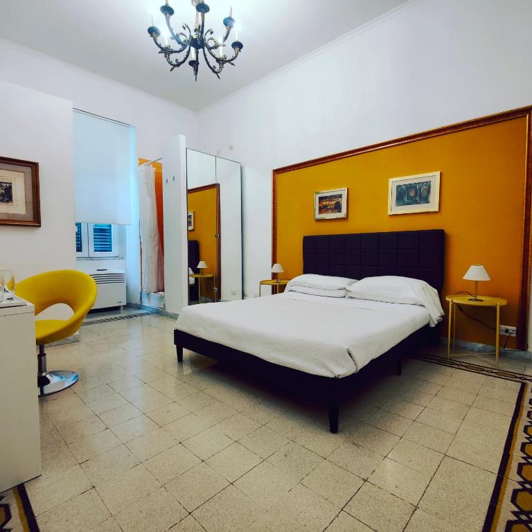 Säng eller sängar i ett rum på AcB Vaticano Suites