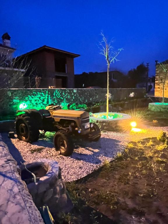 a truck parked in a yard at night at Emel Hanım butik otel&restoran in Urla