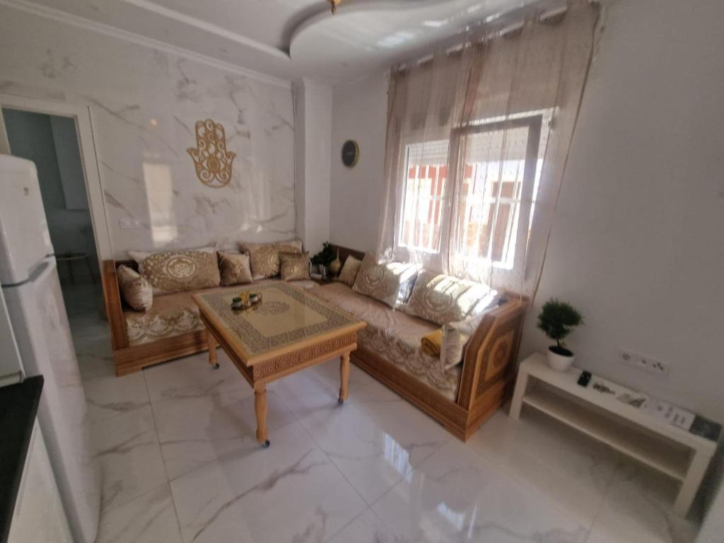 a living room with a couch and a table at Casa estilo Riad Fez en Lo Pagan in San Pedro del Pinatar