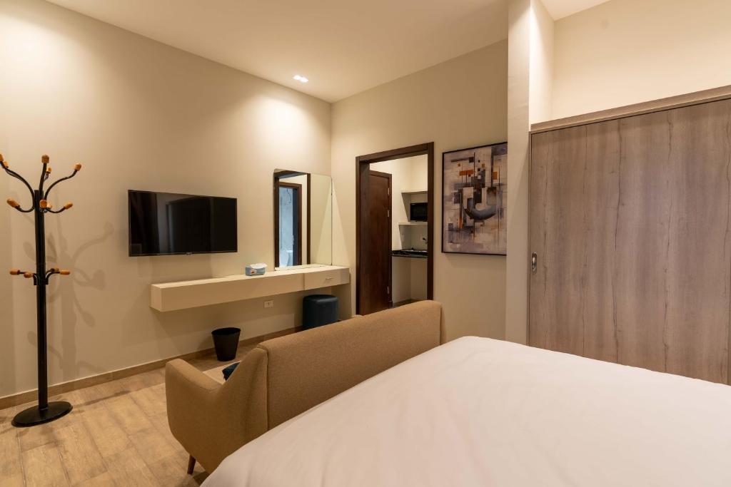TV a/nebo společenská místnost v ubytování Sleep Inn Apart-Hotel