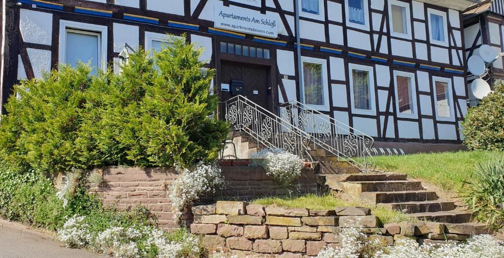 a building with a staircase in front of it at Apartaments Am Schloß in Bevern